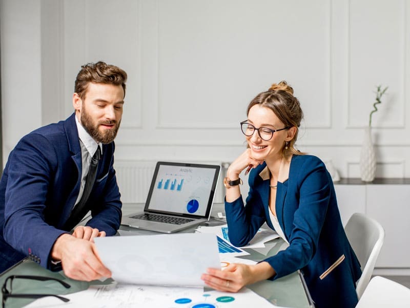 Financial-Planner-with-client A financial advisor working with a client