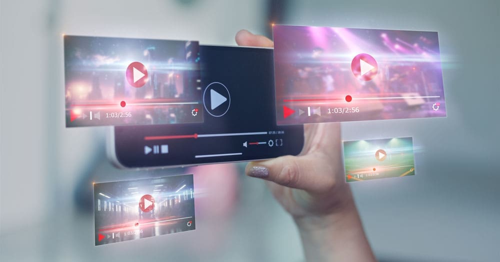 multiple-videos close-up of Hands holding mobile phone with videos
