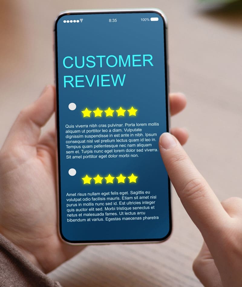 Customer-Review-On-Phone2 hands holding a phone with customer reviews showing on the screen
