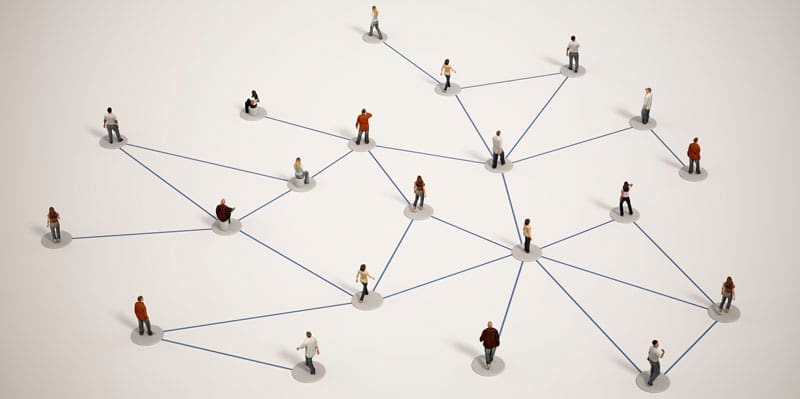 Directory-Dilemma Miniature People Connected by Lines on a White Surface.